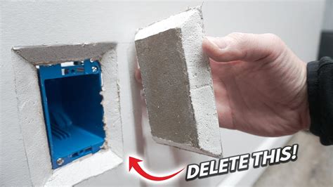 patching electrical box hole in drywall|installing drywall patch on electrical outlet.